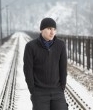 17547371-young-man-on-railroad-track-in-winter
