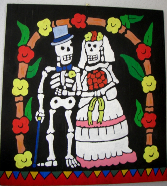 I painted this with acrylics on 24" x 24" half inch plywood. It is a modified copy: Day of the Dead ceramic tile(6" x 6") by La Fuente Imports.  