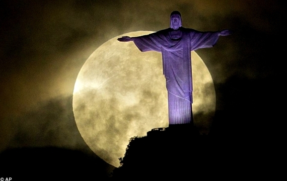Super moon behind Christ the Redeemer statue, Rio de Janeiro, Brazil, 2014